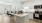 model kitchen with white cabinets and island