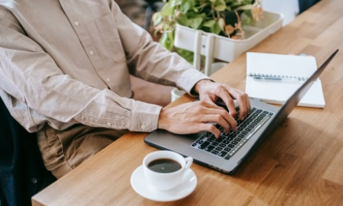 The essence of exceptional living person typing on laptop