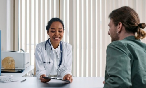 Preferred Employer Program doctor talking to patient